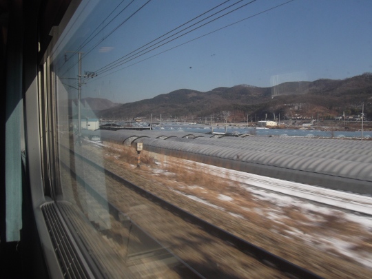 View from the high speed train (my favorite way to travel in any country)- with hills everywhere in Korea